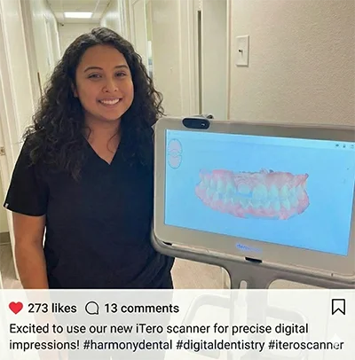 Friendly Pure Santa Ana Dentist team member smiling next to our advanced iTero 3D digital scanner, used for comfortable, goop-free impressions